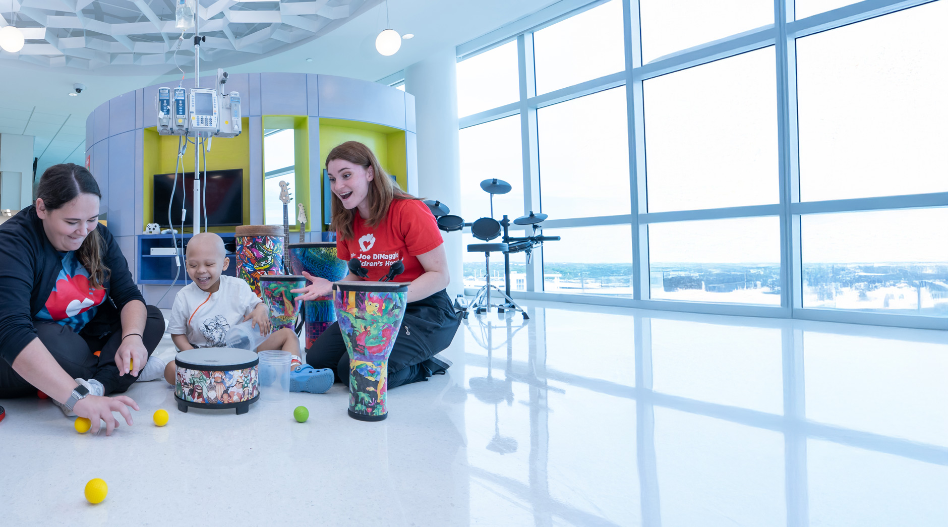 Child Life Specialist with patient during music therapy